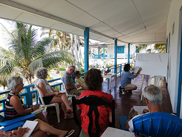 Group taking a drawing class during Walk the Arts art workshop in South America
