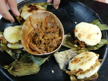 Meat and arepas typical Colombian food during Walk the Arts winter getaway in South America