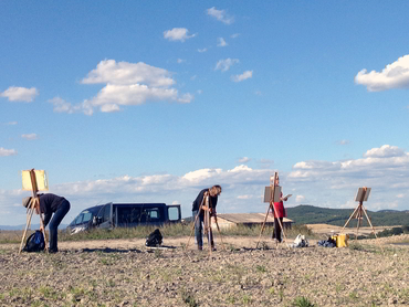 Group of people setting up their easels to paint the landscape during Walk the Arts art retreats in Italy